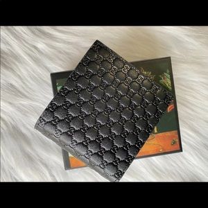 Gucci wallet. All black embossed G design.